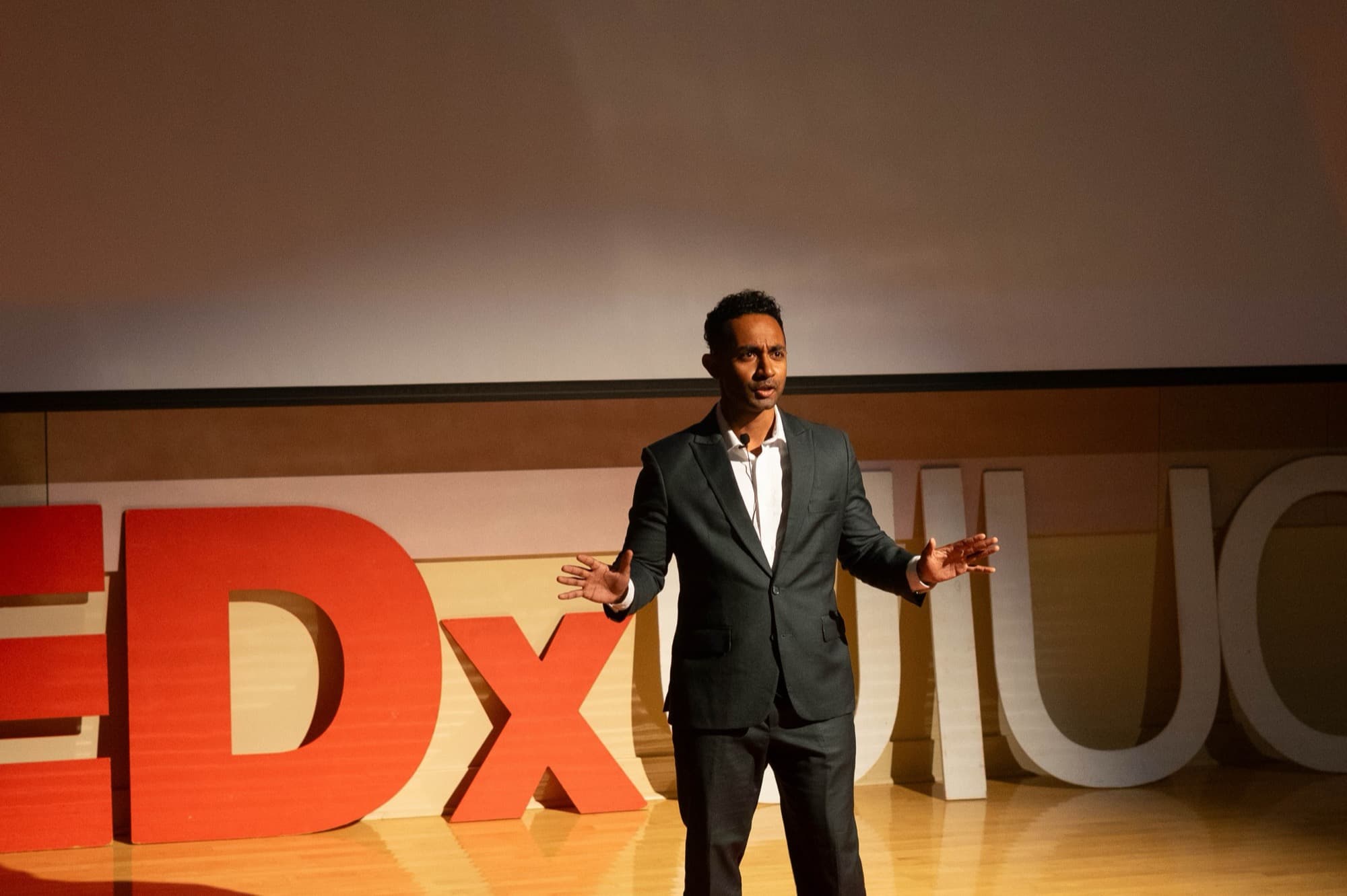 TEDx stage with dramatic red lighting
